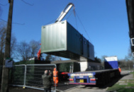 Container unit home being delivered 6