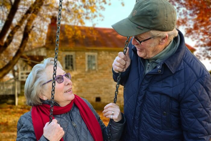 Elderly couple with a swing