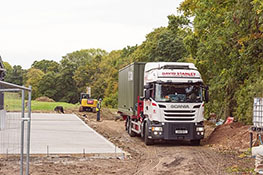 Container building unit on a lorry at a building site