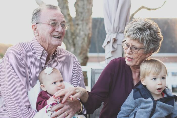 Elderly couple with grandchildren